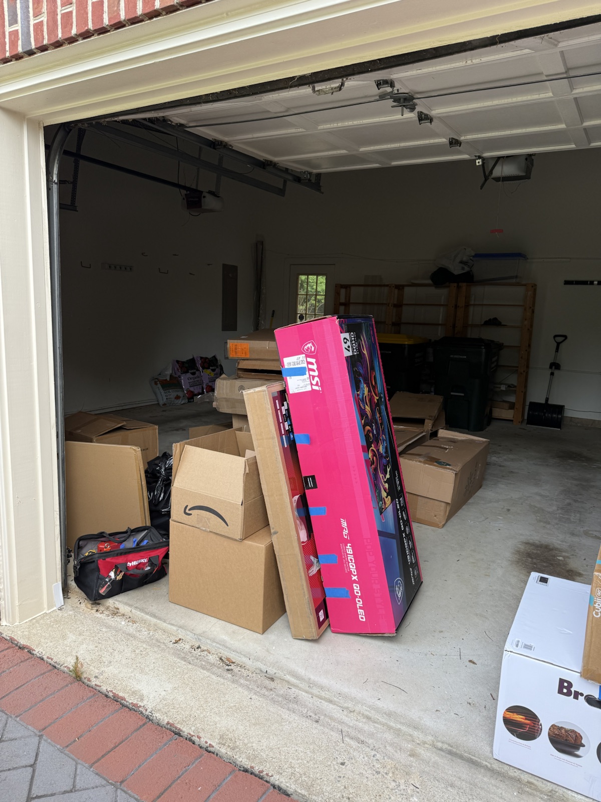 Garage filled with boxes before a NewPath Junk Removal cleanout