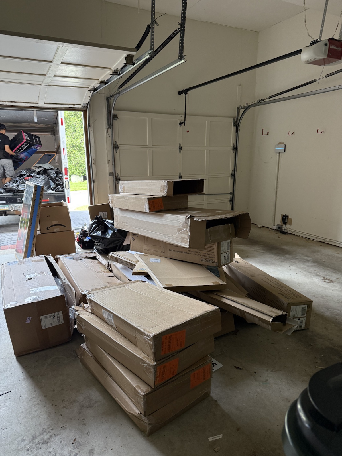 NewPath crew loading boxes during a garage cleanout