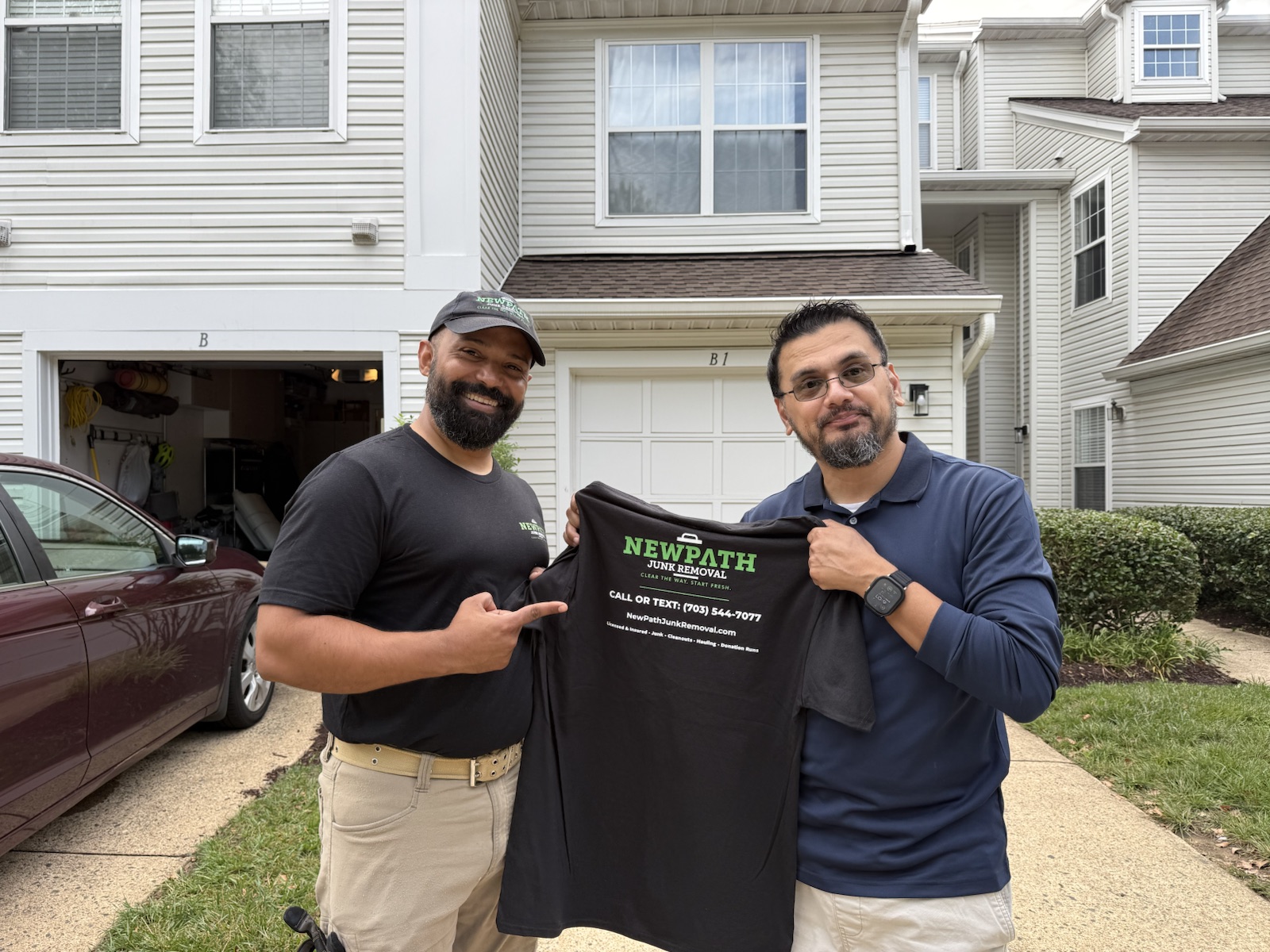 Carlos Medina of NewPath Junk Removal with a local customer